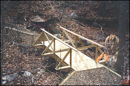 New construction of a bridge and trail to the Psyche Spring site. The Psyche Spring was cleaned and restored in 2003 along with the new trail and bridge.