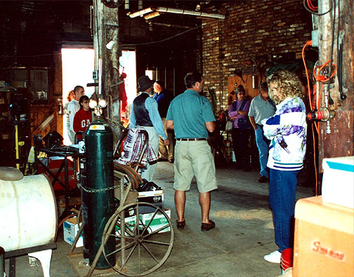 In the service area of the garage with tour group.