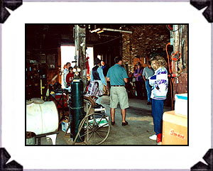 In the service area of the garage with tour group.