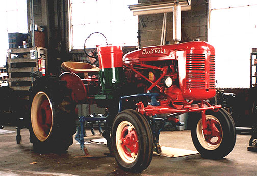 1940s International Farmall tractor with fertilizer attachment and cultivators mounted. Fully restored.