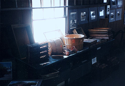 Potting bench with hand made tools including seeding tools from the 1930s.