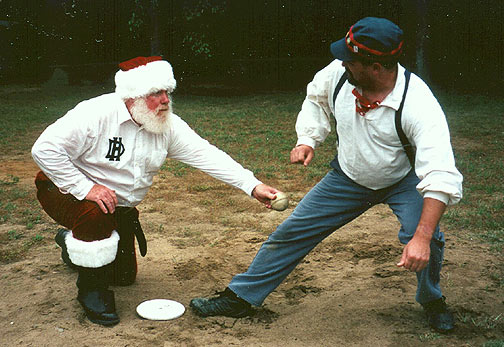 SANTA 'BILL' CLAUS: Bill Swank, historian for the San Diego Padres, joined us at Eastman Field for a match with the Bonneyville Millers. Bill had on his House of David Echoes Santa suit and has now been portrait painted and a figurine has been made of him in the international collection of Santa Claus. We are proud to have him occasionally appear from the north country to help us through a match of his favorite pre-Christmas activity. When you play the Echoes with Santa, 'you better watch out, you better not lie', we're a tellin' Ya why ....