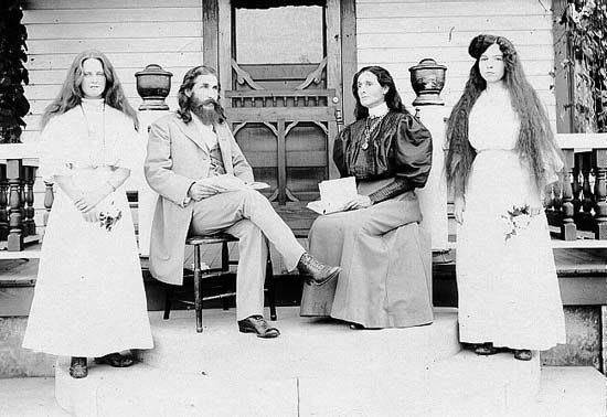 Benjamin and Mary Purnell with two Israelite school girls on Bethlehem porch. 1909